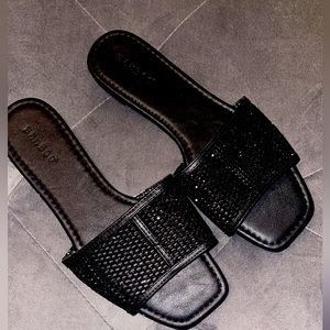 Woman’s Flat Black Mesh Sandals